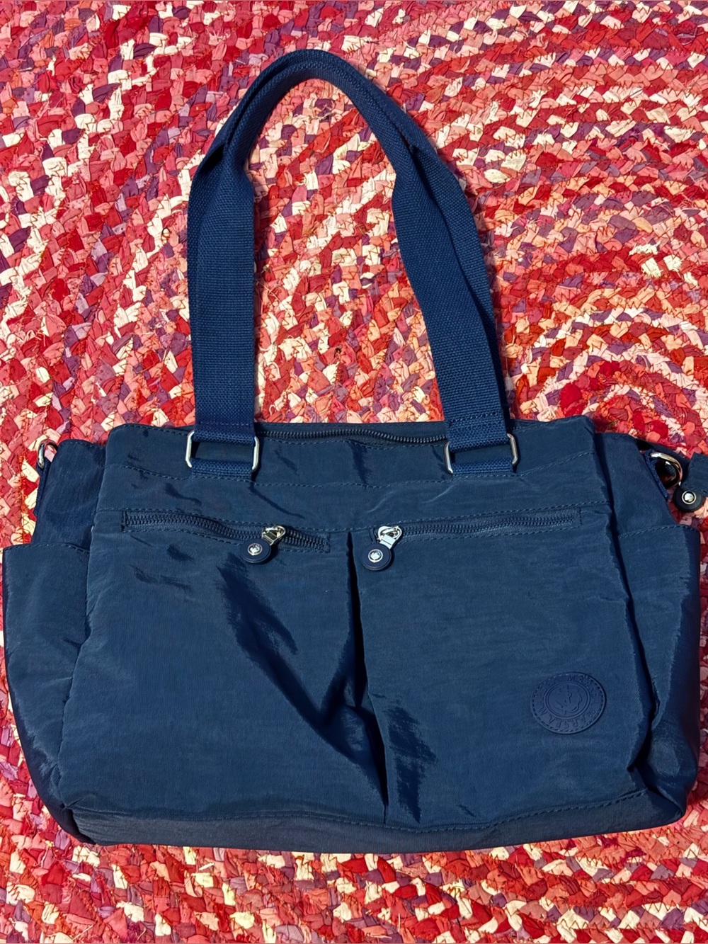 Women’s large compartment waterproof crossbody and shoulder bag, EUC Navy Blue